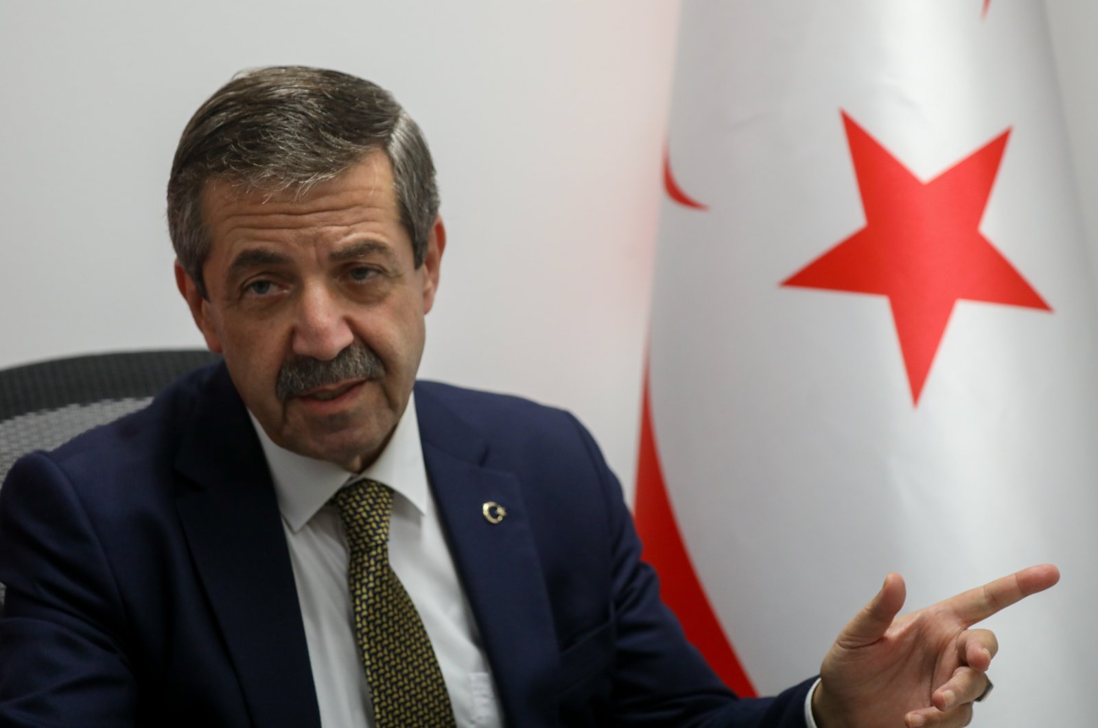 TRNC Foreign Minister Tahsin Ertuğruloğlu speaks to reporters, Oct. 10, 2021. (AA File Photo)