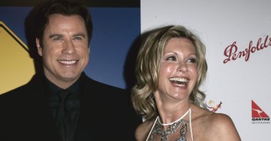 John Travolta (L) and Olivia Newton-John arrive at The Penfolds Icon Gala Dinner in Los Angeles, California, U.S., Jan. 14, 2006. (AP Photo)
