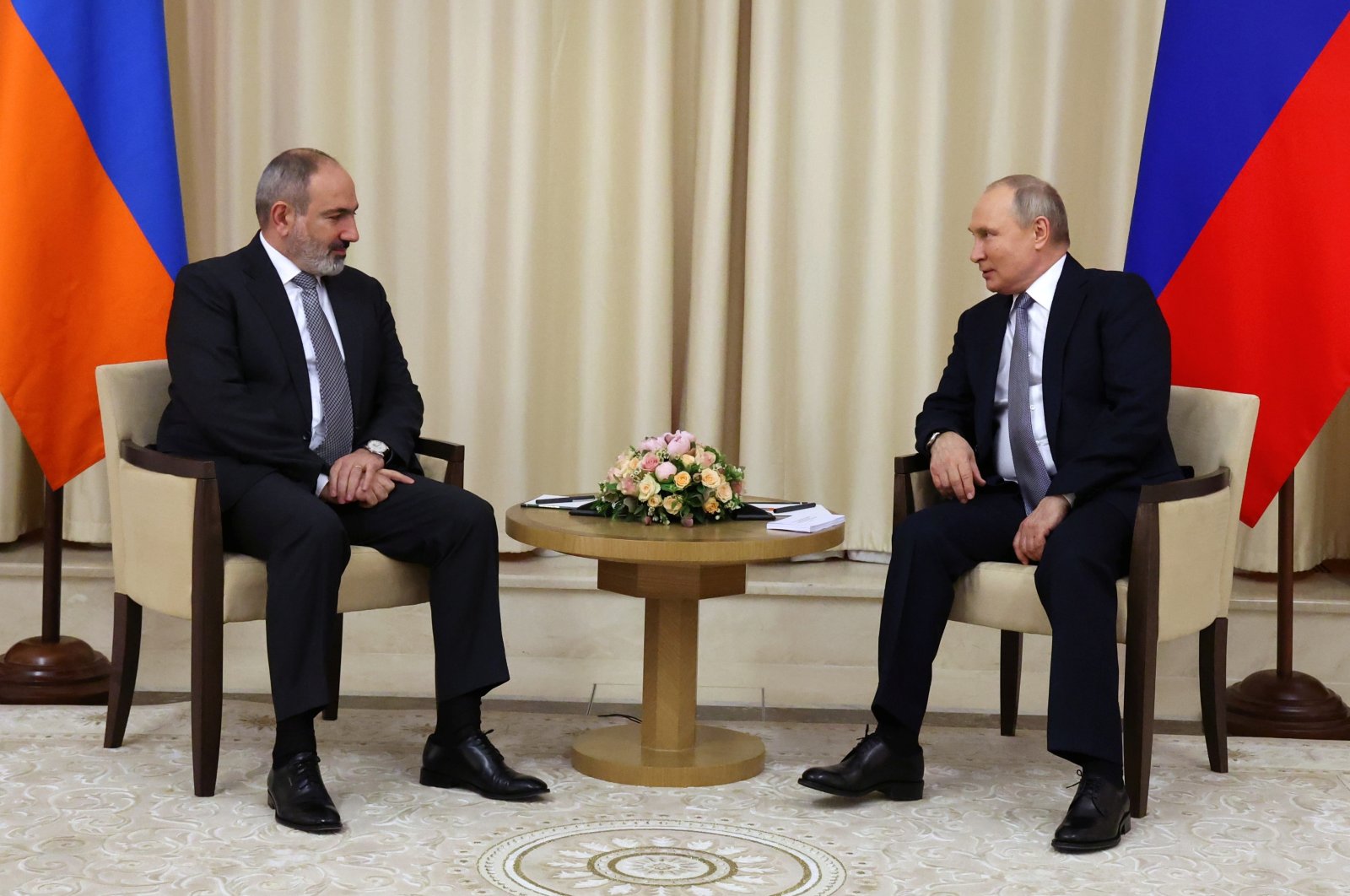 Armenian Prime Minister Nikol Pashinian (L) attends a meeting with Russian President Vladimir Putin at the Novo-Ogaryovo state residence outside Moscow, Russia, April 19, 2022. (Sputnik via Reuters)