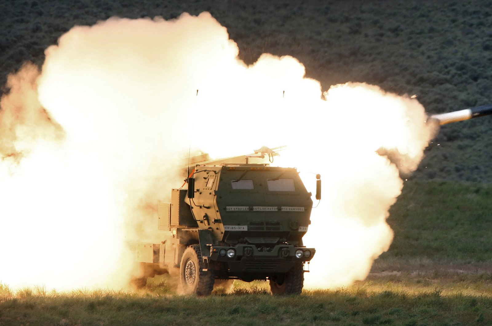 A launch truck fires the High Mobility Artillery Rocket System (HIMARS) produced by Lockheed Martin during combat training in the high desert of the Yakima Training Center, Washington, U.S., May 23, 2011. (AP Photo)