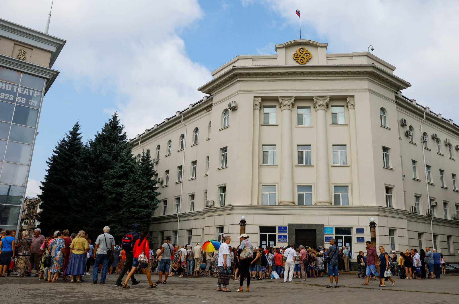 Local residents gather to receive financial aid during the Ukraine-Russia conflict in the Russia-controlled city of Kherson, Ukraine, July 25, 2022. (Reuters Photo)