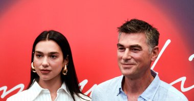 English singer and songwriter Dua Lipa (L) and her father Dukagjin Lipa pose after a press conference ahead of her performance at the Sunny Hill Festival in Pristina, Kosovo, Aug. 4, 2022. (AFP Photo)
