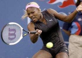 Serena Williams, of the United States, makes a return to compatriot Lindsay Davenport during their semifinal match at the U.S. Open tennis tournament in New York, Sept. 6, 2002. (AP Photo/Elise Amendola, File)
