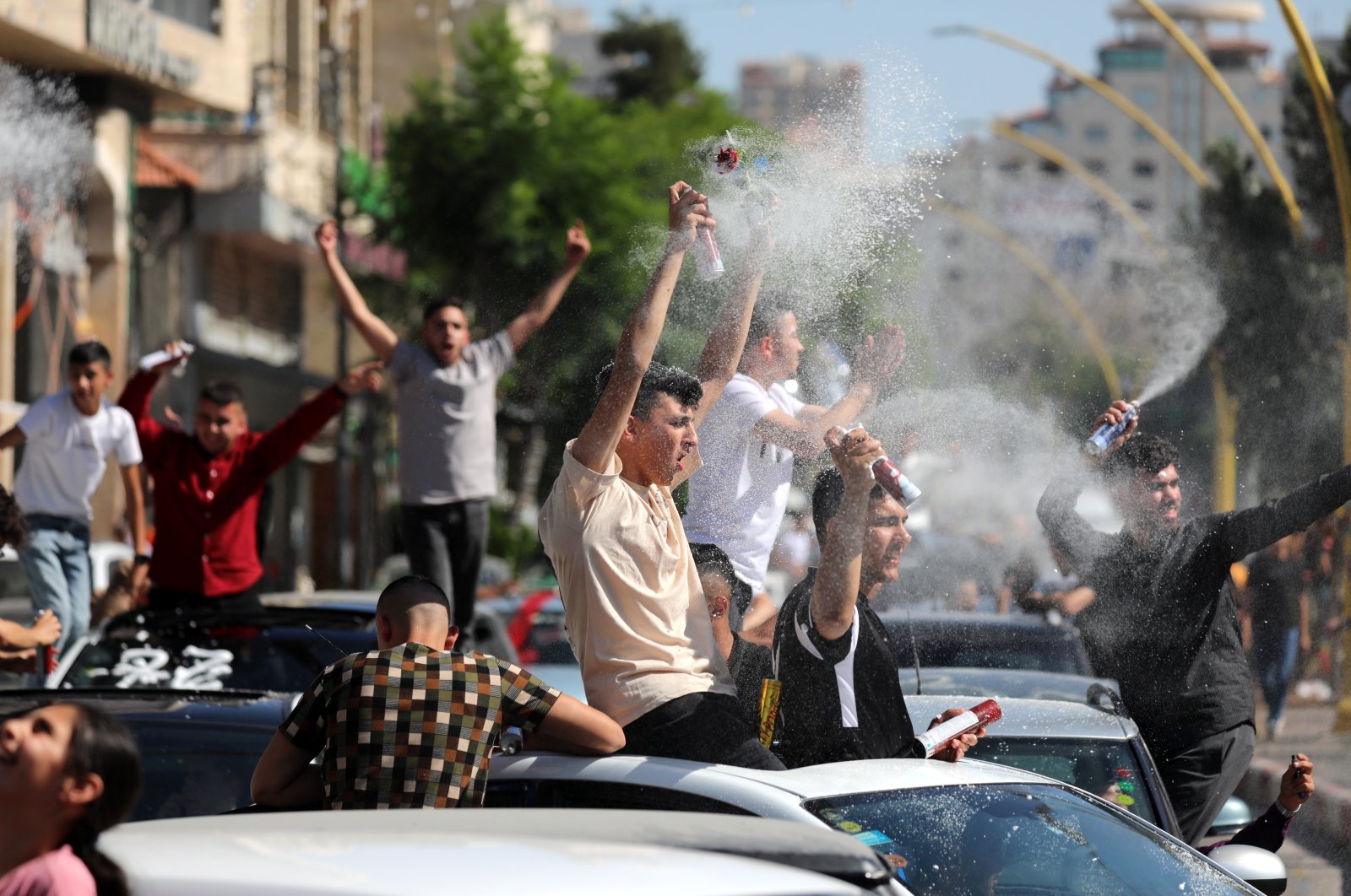 Palestinian high school students celebrate after receiving their exam results in a convoy of cars on the streets of Hebron, West Bank, Palestine, July 30, 2022. (EPA Photo)