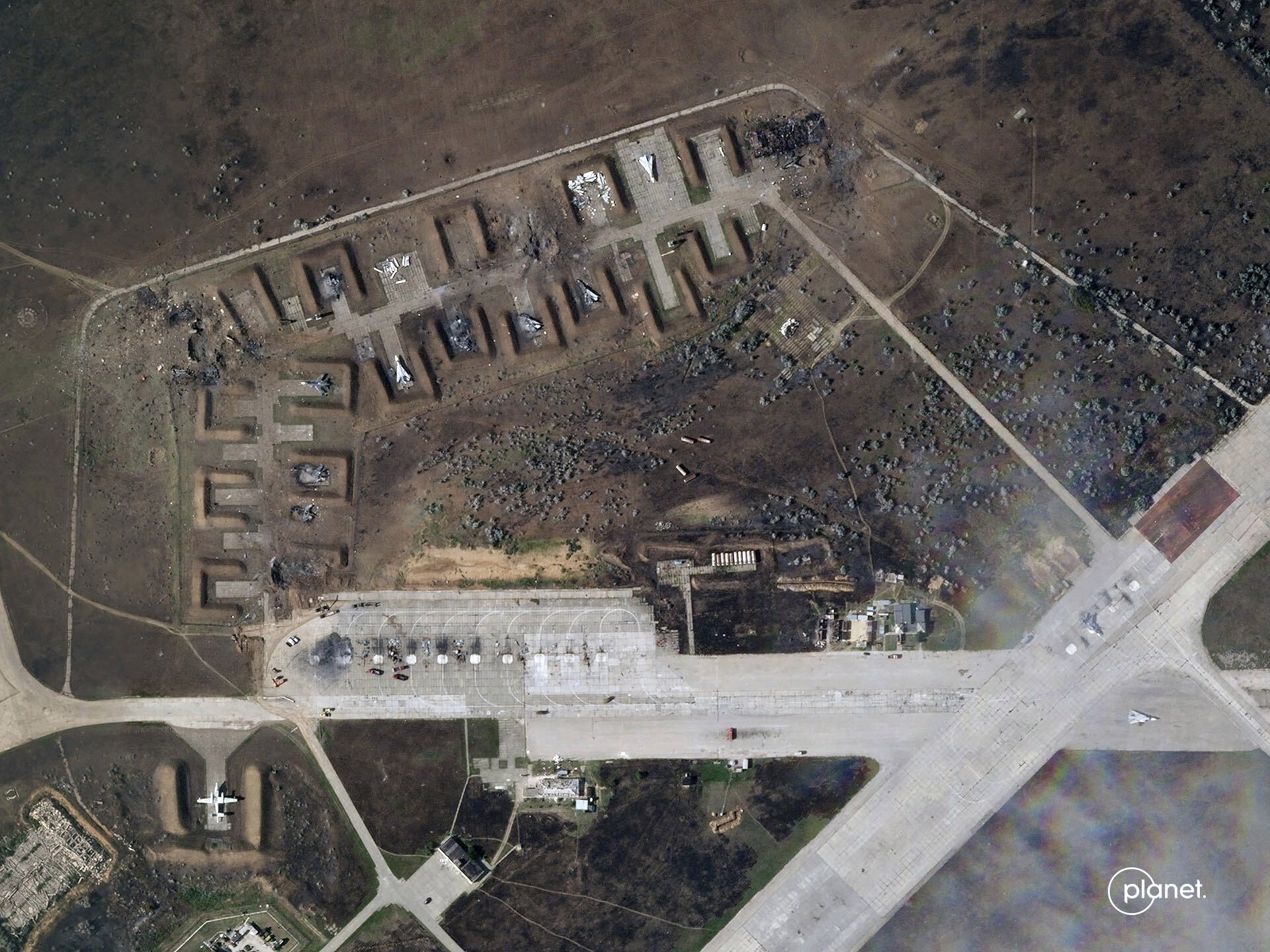 This satellite image provided by Planet Labs PBC shows destroyed Russian aircraft at Saki Air Base after an explosion Tuesday, Aug. 9, 2022, in the Crimean Peninsula. (Planet Labs PBC via AP)