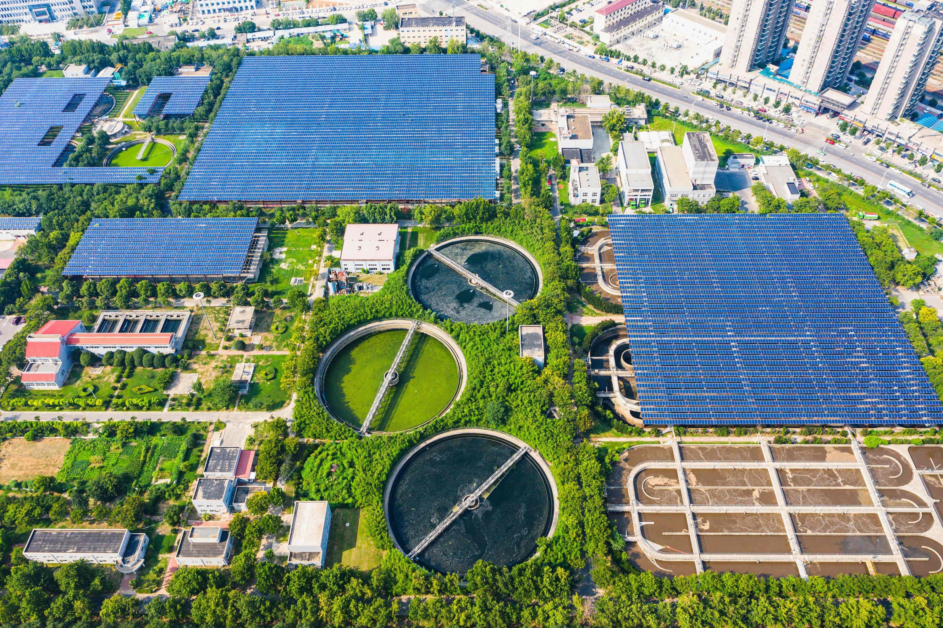 This aerial photo shows solar panels built over a sewage treatment plant, as the plant uses photovoltaic power to partly replace coal power, in Zhengzhou, Henan province, China, Aug. 4, 2022. (AFP Photo) 