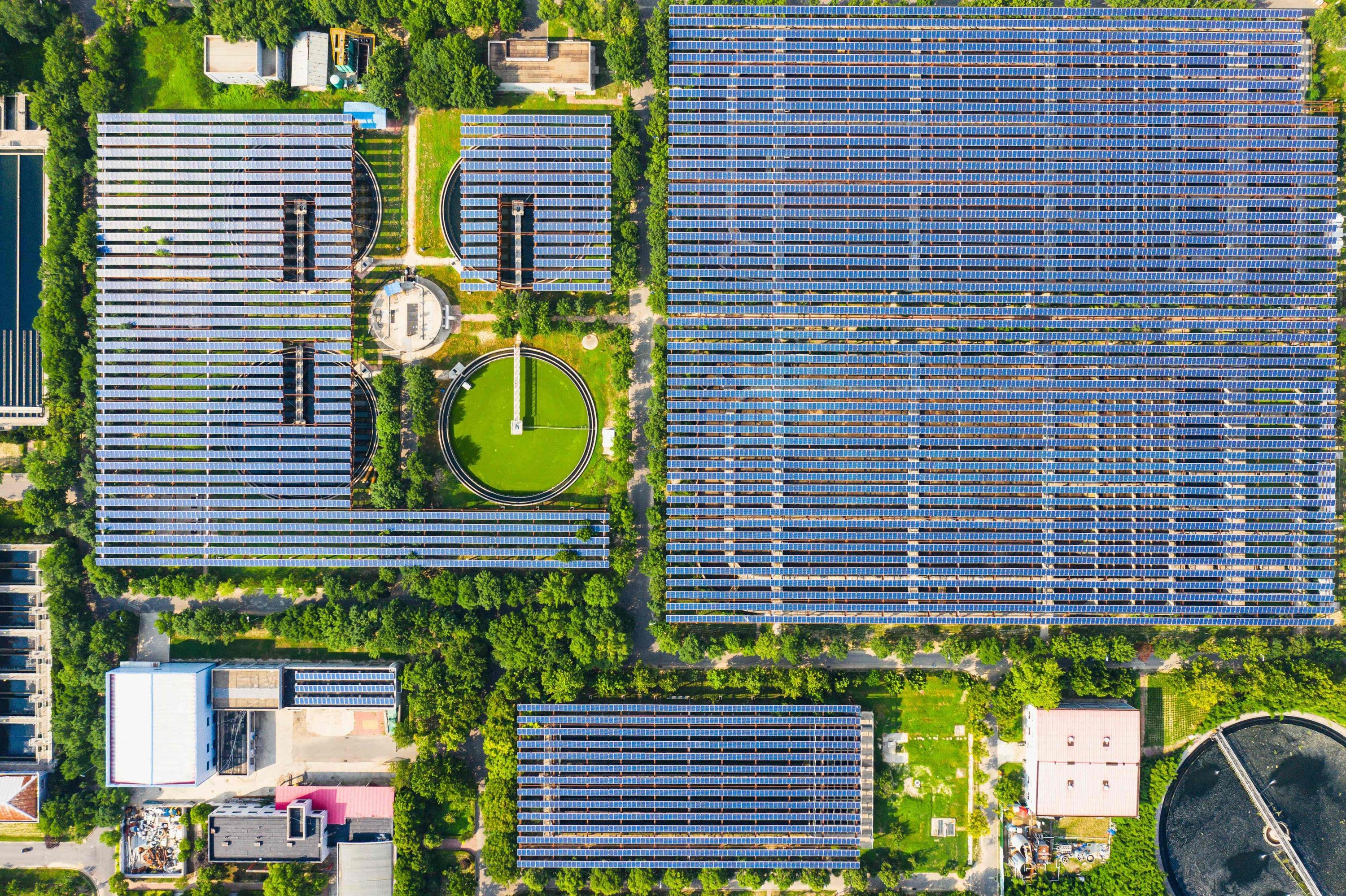 This aerial photo shows solar panels built over a sewage treatment plant, as the plant uses photovoltaic power to partially replace coal power, in Zhengzhou, Henan province, China, Aug.  4, 2022. (AFP Photo) 
