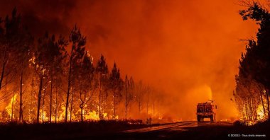 This photo shows firefighters tackling a blaze near Saint-Magne, south of Bordeaux, southwestern France, Aug. 10, 2022. (SDIS 33 via AP)