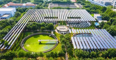 This aerial photo shows solar panels built over a sewage treatment plant in Zhengzhou, Henan province, China, Aug. 4, 2022. (AFP Photo)