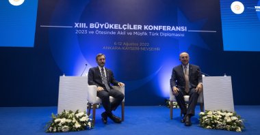 FM Mevlüt Çavuşoğlu (R) and Presidential Communications Director Fahrettin Altun come together at the 13th Ambassadors Conference, Türkiye, Aug. 11, 2022. (AA Photo)