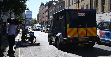 Media members watch a van carrying British terror suspect Aine Davis as he is transported from Westminster Magistrates Court in London, Britain, Aug. 11, 2022. (EPA Photo)
