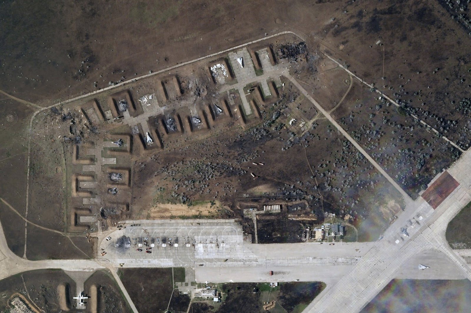 This satellite image provided by Planet Labs PBC shows destroyed Russian aircraft at Saki Air Base after an explosion Tuesday, Aug. 9, 2022, in the Crimean Peninsula, the Black Sea peninsula seized from Ukraine by Russia and annexed in March 2014. Ukraine&#039;s air force said Wednesday, Aug. 10, 2022 that nine Russian warplanes were destroyed in a deadly string of explosions at an air base in Crimea that appeared to be the result of a Ukrainian attack, which would represent a significant escalation in the war. (Planet Labs PBC via AP)