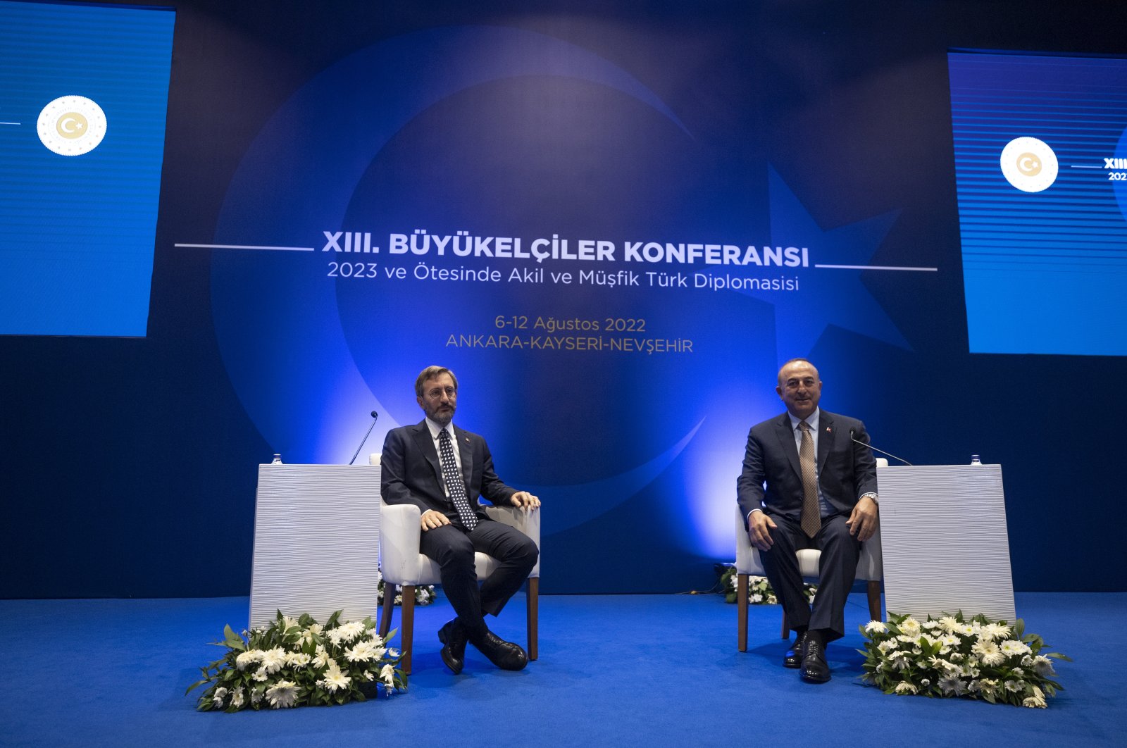 FM Mevlüt Çavuşoğlu (R) and Presidential Communications Director Fahrettin Altun come together at the 13th Ambassadors Conference, Türkiye, Aug. 11, 2022. (AA Photo)