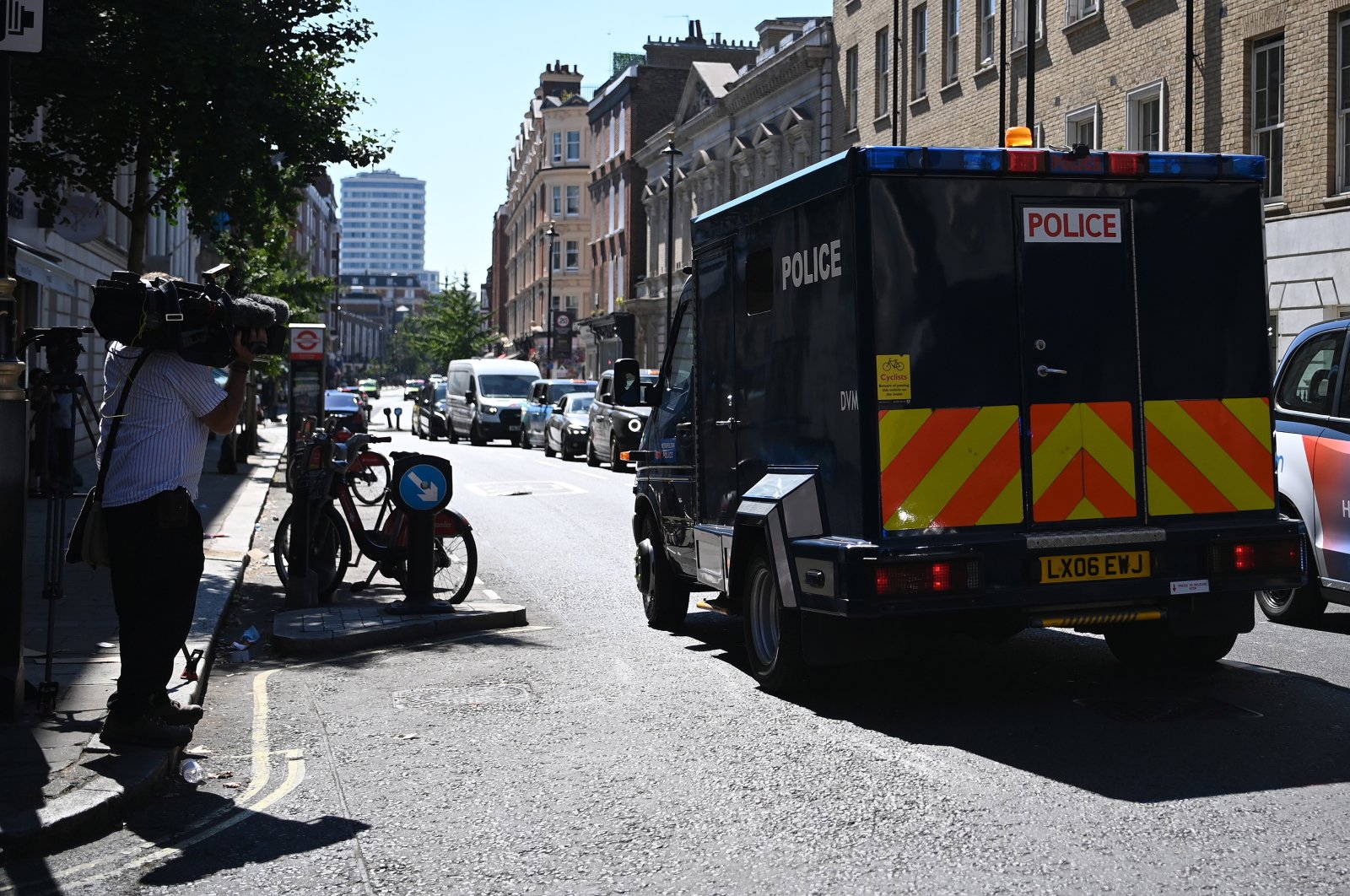 Media members watch a van carrying British terror suspect Aine Davis as he is transported from Westminster Magistrates Court in London, Britain, Aug. 11, 2022. (EPA Photo)