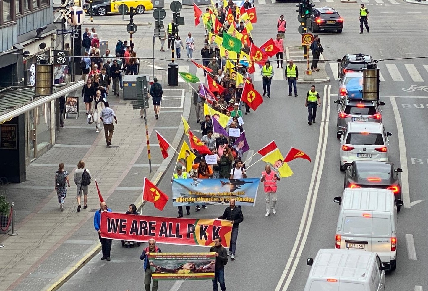 PKK/YPG terrorist sympathizers carrying portraits of PKK leader and so-called flags of the terrorist group march in Stockholm, Sweden, July 27, 2022. (AA File Photo)