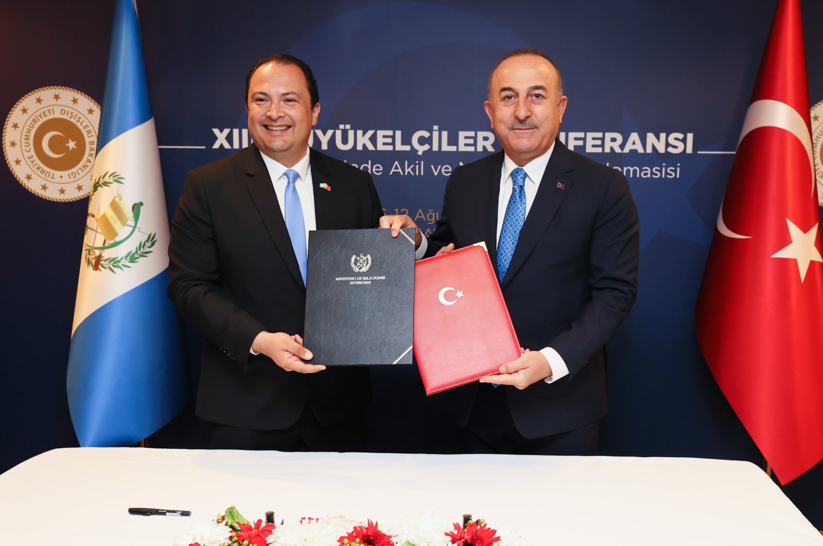 Foreign Minister Mevlüt Çavuşoğlu (R) and Guatemalan Foreign Minister Mario Adolfo Bucaro Flores (L) come together at the 13th Ambassadors&#039; Conference in the capital Ankara, Türkiye, Aug.11, 2022. (AA Photo)
