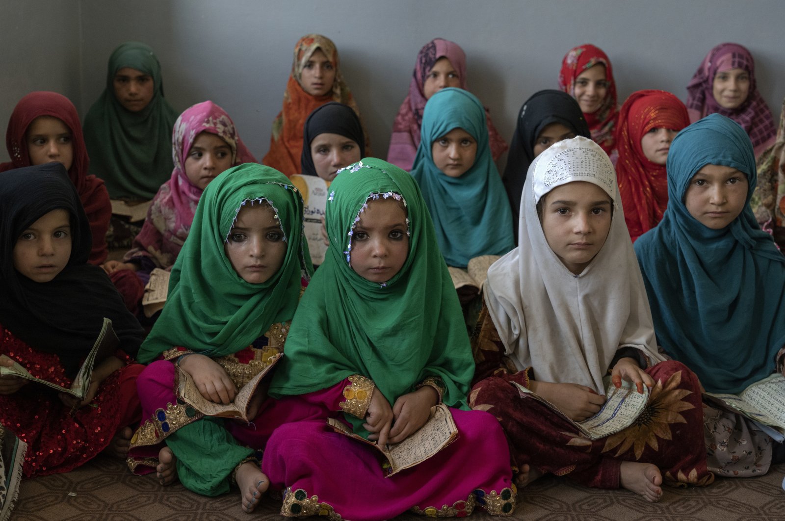 Afghan girls read the Quran in the Noor Mosque outside the city of Kabul, Afghanistan, Aug. 3, 2022. (AP Photo)
