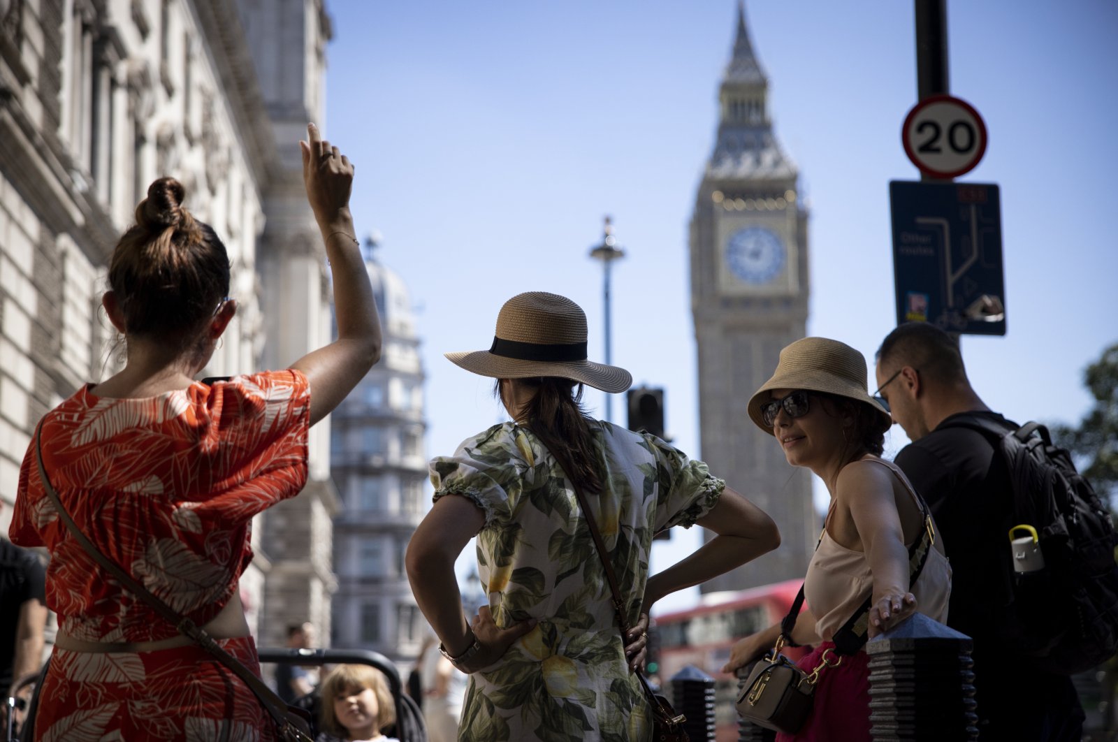 People wear hats as a precaution against the hot weather in Westminster, London, U.K., Aug. 11, 2022. (EPA Photo)
