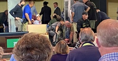 Author Sir Salman Rushdie treated by emergency personnel after being stabbed onstage before his scheduled speech at the Chautauqua Institution in Chautauqua, New York, U.S., Aug. 12, 2022, in this picture obtained from social media. (Mary Newsom via Reuters TPX Images of the Day)