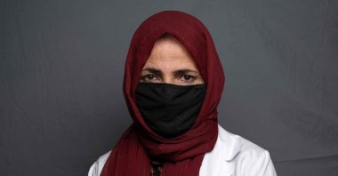 Doctor and mental health counsellor Mursal, 35, poses for a portrait at an undisclosed location in Afghanistan, Aug. 6, 2022. (AFP Photo)