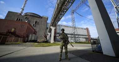 A Russian serviceman guards the Zaporizhzhia Nuclear Power Station, southeastern Ukraine, May 1, 2022. (AP Photo)