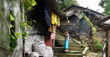 A Rohingya refugee child stands outside makeshift houses in Balulkhali refugee camp, Ukhia, Bangladesh, Aug. 14, 2022. (AFP Photo)