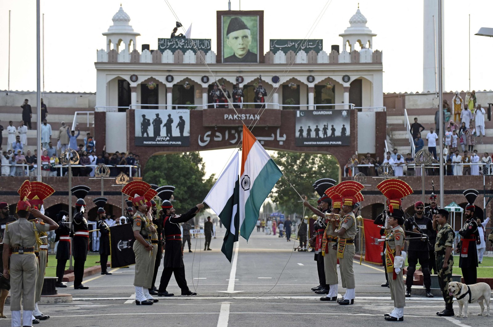 Indian Border Security Force (BSF) soldiers (in brown) and Pakistani Rangers take part in the Beating the Retreat ceremony at the India-Pakistan Wagah border post, Amritsar, India, Aug. 1, 2022. (AFP Photo)