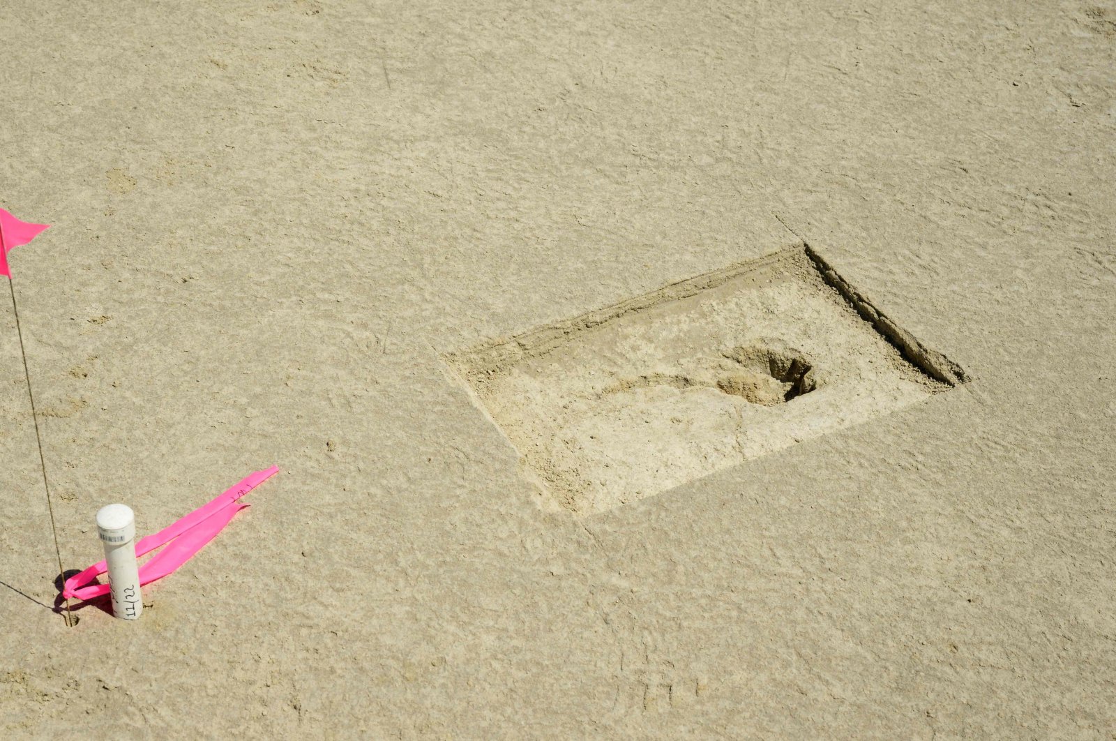 A footprint discovered on an archaeological site marked with a pin flag on the Utah Test and Training Range, Utah, U.S., July 18, 2022. (U.S. Airforce via AFP)