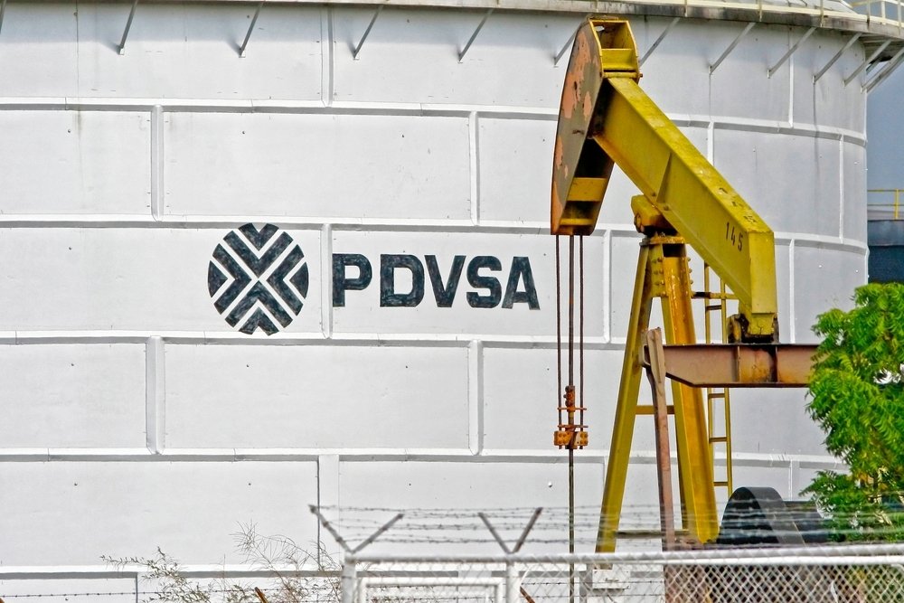 An oil tank of PDVSA is seen in front of an oil extraction pump, Cabimas, Venezuela, July 7, 2007. (Shutterstock)