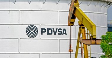 An oil tank of PDVSA is seen in front of an oil extraction pump, Cabimas, Venezuela, July 7, 2007. (Shutterstock)