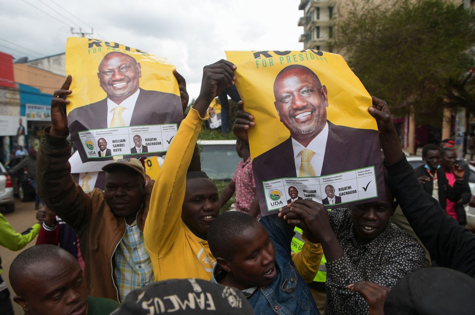 Supporters hold posters of William Ruto, Kenya&#039;s deputy president and presidential candidate of the Kenya Kwanza (Kenya First) political party coalition, as they gather while waiting for the results of Kenya&#039;s general election in Eldoret, Kenya, Aug. 15, 2022. (AFP Photo)