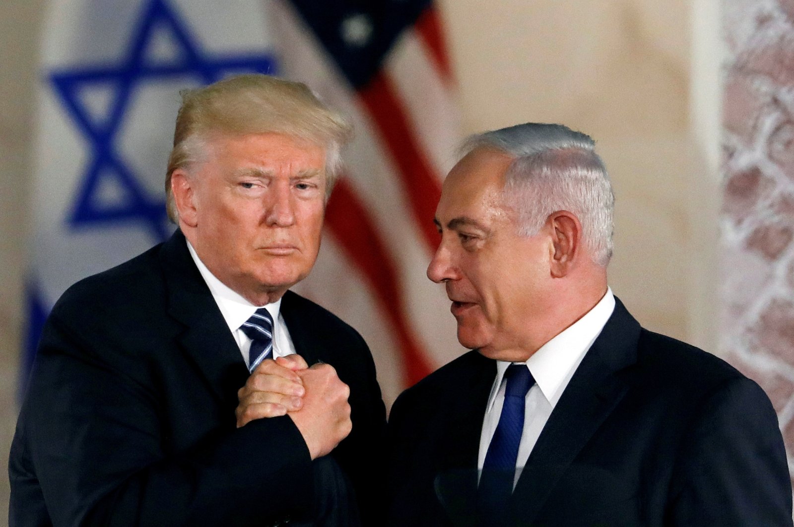 Then-U.S. President Donald Trump and former Israeli Prime Minister Benjamin Netanyahu shake hands after Trump&#039;s address at the Israel Museum in West Jerusalem, Israel, May 23, 2017.  (Reuters File Photo)
