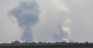 A view shows smoke rising above the area following an alleged explosion in the village of Mayskoye in the Dzhankoi district, Crimea, Ukraine, Aug. 16, 2022. (Reuters Photo)