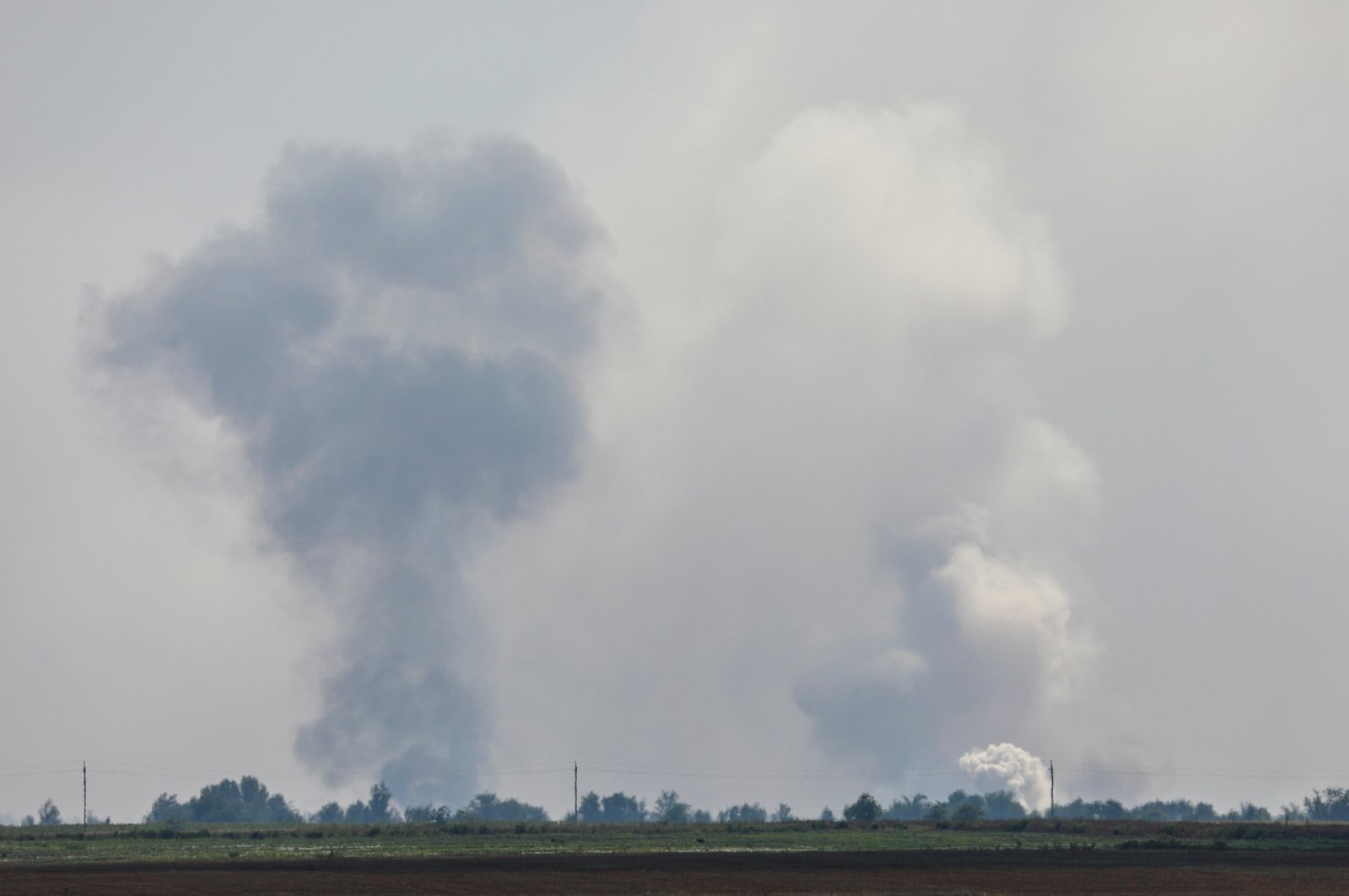 A view shows smoke rising above the area following an alleged explosion in the village of Mayskoye in the Dzhankoi district, Crimea, Ukraine, Aug. 16, 2022. (Reuters Photo)