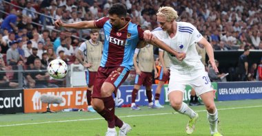 Trabzonspor's Trezeguet (L) vies with Copenhagen's Victor Kristiansen in the UEFA Champions League playoffs, Copenhagen, Denmark, Aug. 16, 2022. (AA Photo)