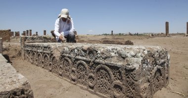 An archaeologists works on a newly discovered cenotaph at the Ahlat Seljuk Meydan Cemetery, Bitlis,  eastern Türkiye, Aug. 16, 2022. (AA) 
