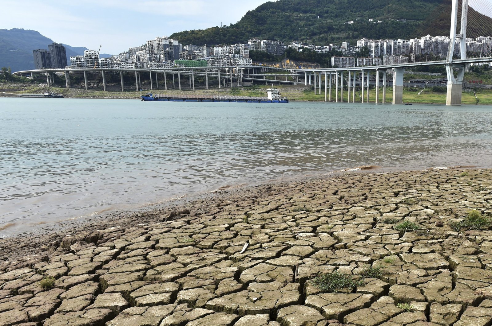 A dried riverbed is exposed after the water level drops in the Yangtze River in Yunyang county in southwest China&#039;s Chongqing municipality, Aug. 16, 2022. (AP Photo)