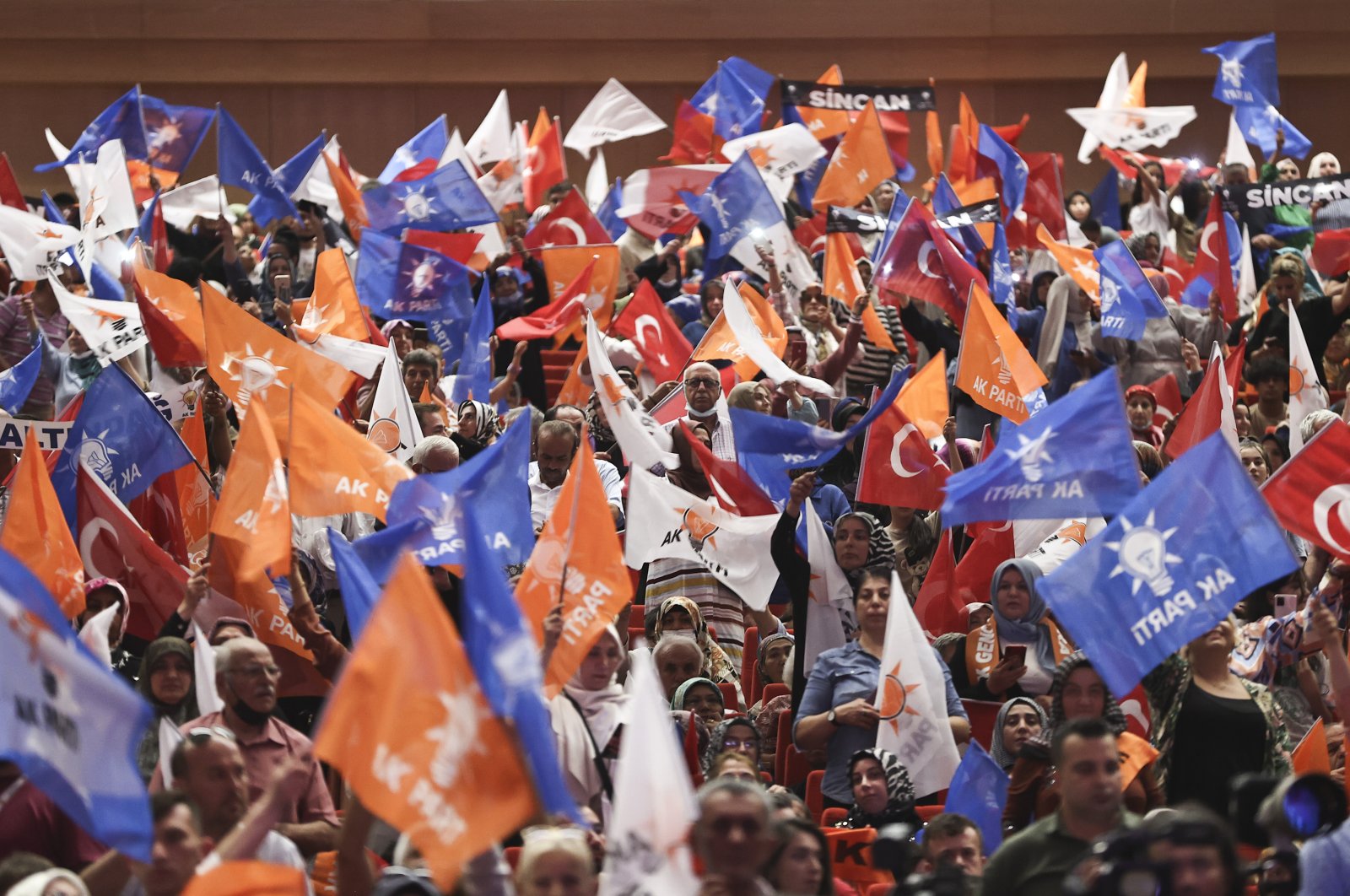 Supporters of the Justice and Development Party (AK Party) wave their flags at the AK Party&#039;s 21st founding anniversary in ATO Congresium in the capital Ankara, Türkiye, Aug. 15, 2022. (AA Photo)