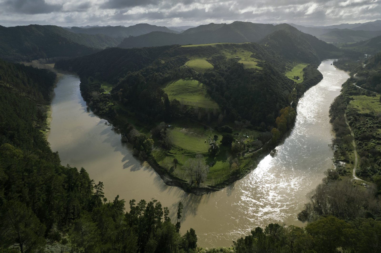 The lower reaches of the Whanganui River flow near the Kaiwhaiki settlement in New Zealand, June 15, 2022. (AP Photo)