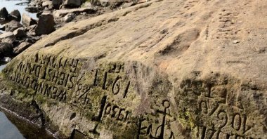 One of the "hunger stones" is revealed by the low level of water in the Elbe River, Germany, 2018. (Sabah Archive Photo)