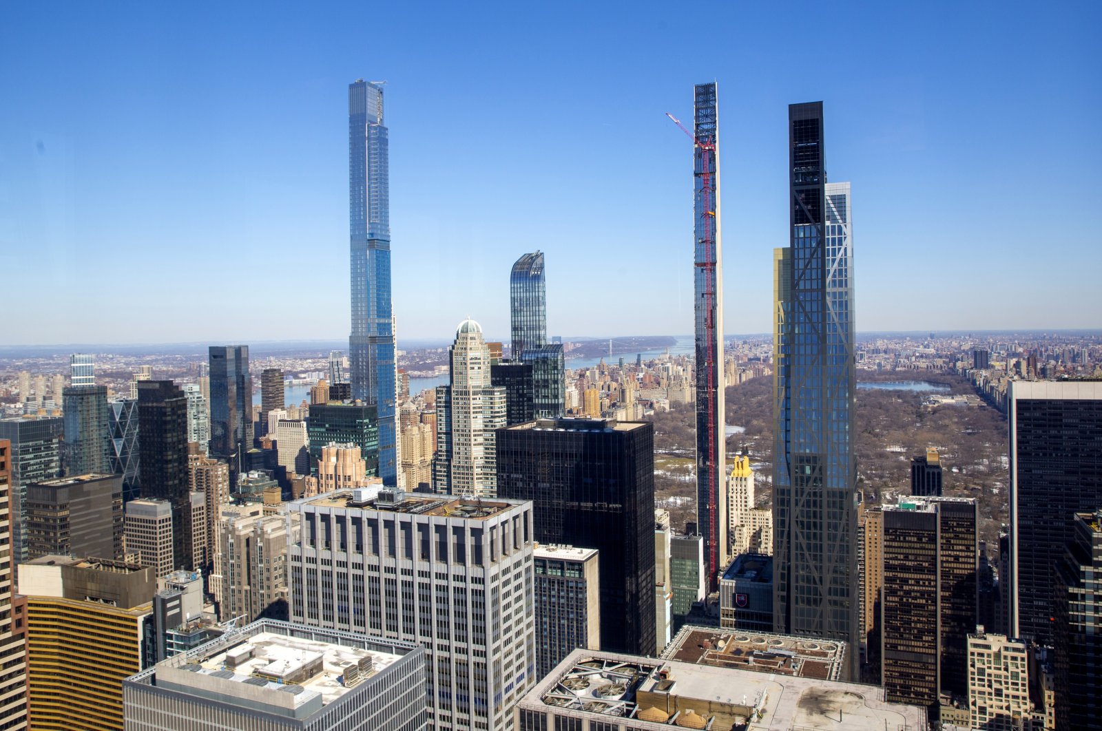Four residential skyscrapers tower over the skyline south of Central Park in the Manhattan borough of New York City. (L-R), Central Park Tower, One57, Steinway Tower and the MoMA Expansion Tower, U.S., Feb. 26, 2021. (AP Photo)