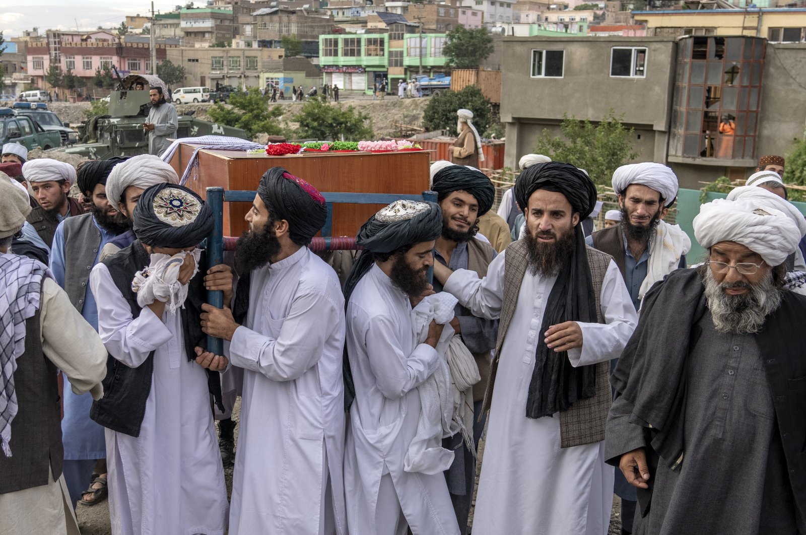 Mourners carry the body of a victim of a mosque bombing in Kabul, Afghanistan, Aug. 18. 2022. (AP Photo)