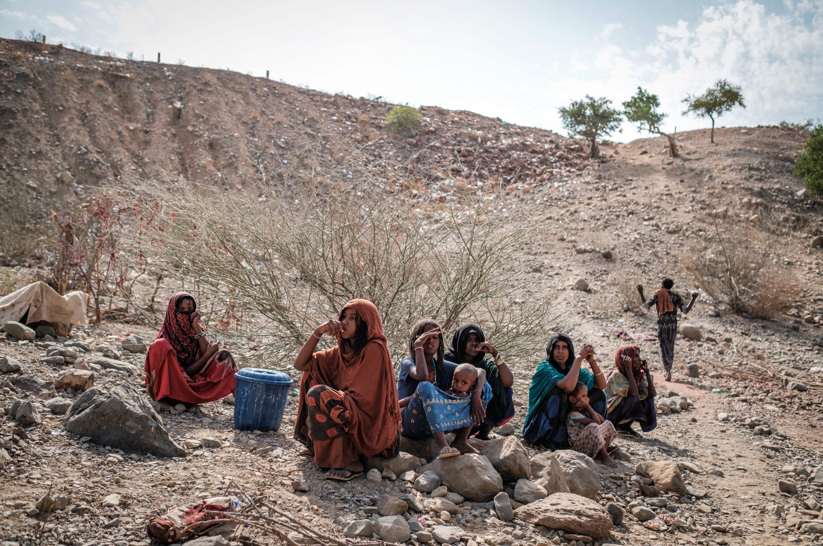 Internally displaced women sit in the makeshift camp where they are sheltered in the village of Erebti, Ethiopia, June 9, 2022. (AFP Photo)
