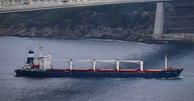 The Sierra Leone-flagged cargo ship Razoni sails under the Yavuz Sultan Selim Bridge after being inspected by Russian, Ukrainian, Turkish and U.N. officials at the entrance of the Bosporus in Istanbul, Turkey, Aug. 3, 2022. (AP Photo)