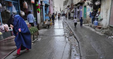 People shop in a market street, in Kabul, Afghanistan, Feb. 8, 2022. (AP Photo)