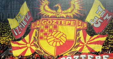 Göztepe fans display the club logo and banners ahead of a Süper Lig match, Izmir, Türkiye, March 3, 2022. (DHA Photo)