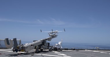 In this image obtained from the U.S. Navy, a Scan Eagle unmanned aerial vehicle is launched from the USNS Spearhead. (AFP Photo / U.S. Navy )