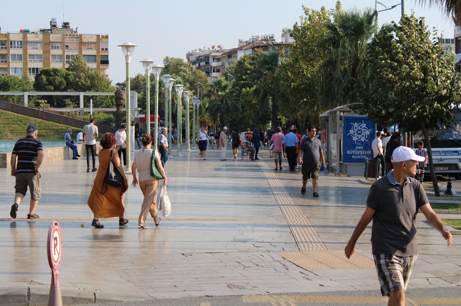 People walk on a street in the Aegean city Aydın, in western Türkiye, Aug. 18, 2022. (İHA PHOTO) 