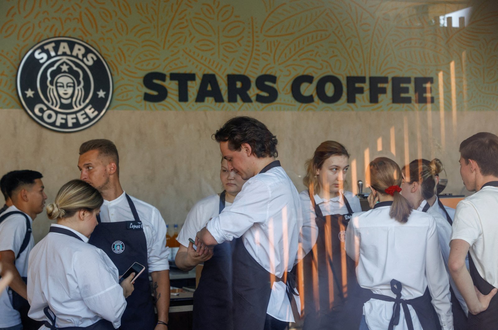 Staff members get ready for the launch of the new coffee shop "Stars Coffee," which opens following Starbucks Corp&#039;s exit from the Russian market, Moscow, Russia, Aug. 18, 2022.  (Reuters Photo)