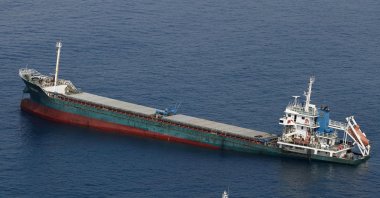 This aerial photo shows Belize-registered cargo ship Xin Hai 99, after a collision, off Kushimoto, Wakayama prefecture, southwestern Japan, Aug. 20, 2022. (AP Photo)